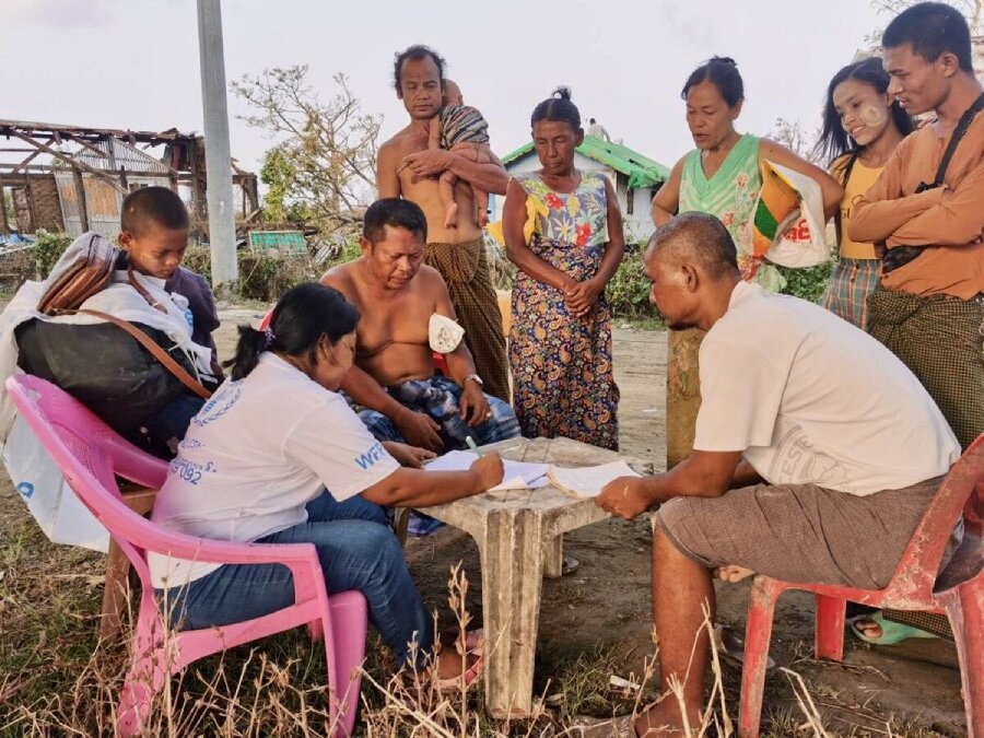 A WFP employee registers Mocha survivors in Rakhine State. WFP fears funding cuts may imperil our humanitarian response in both Myanmar and Bangladesh. Photo: WFP/Aung Khaing Moe